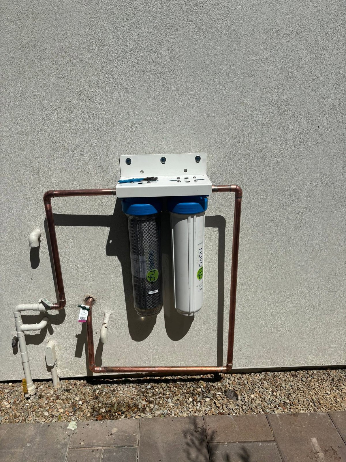 Wall-mounted dual-filter equipment with connected copper piping